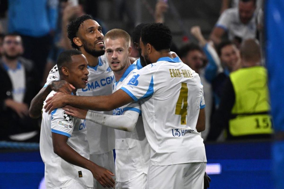 Marseille's Gabonese forward #97 Pierre-Emerick Aubameyang (2ndL) celebrates after scoring his team's fourth goal during the UEFA Champions League, league phase day 2, football match between Olympique de Marseille (FRA) and AFC Ajax (NED) at the Velodrome stadium, in Marseille on September 30, 2025.  Miguel MEDINA / AFP