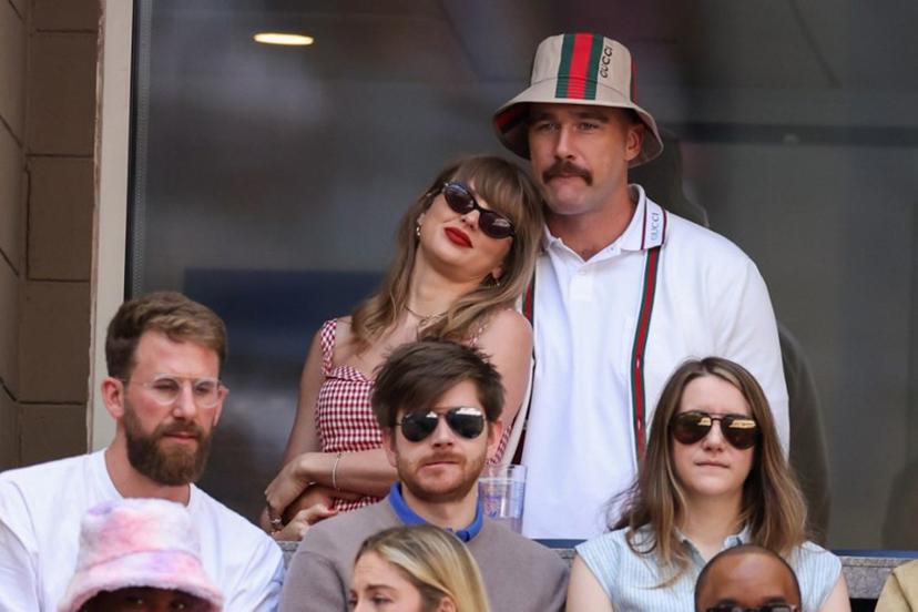 US musician Taylor Swift (L) and US NFL football player Travis Kelce (R) attend the men's final match between Italy's Jannik Sinner and USA's Taylor Fritz on day fourteen of the US Open tennis tournament at the USTA Billie Jean King National Tennis Center in New York City, on September 8, 2024.  CHARLY TRIBALLEAU / AFP
