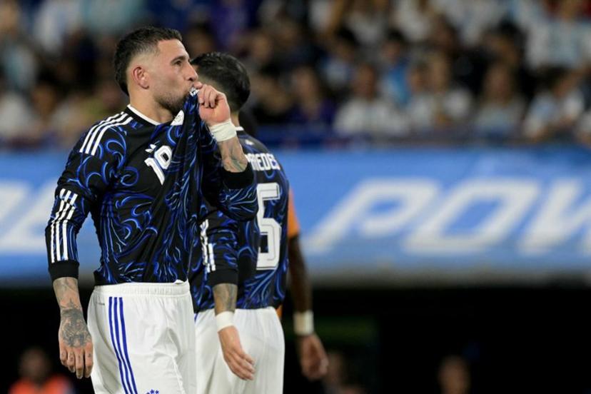 Argentina's defender #19 Nicolas Otamendi celebrates after scoring his team's third goal from the penalty spot during a friendly football match between Argentina and Zambia at La Bombonera stadium in Buenos Aires on March 31, 2026.  JUAN MABROMATA / AFP