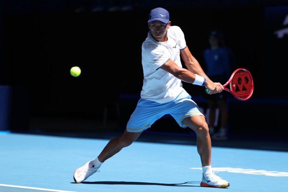 Argentina's Sebastian Baez hits a return to Spain's Jaume Munar during their men's singles match at the United Cup tennis tournament in Perth on January 2, 2026.   COLIN MURTY / AFP