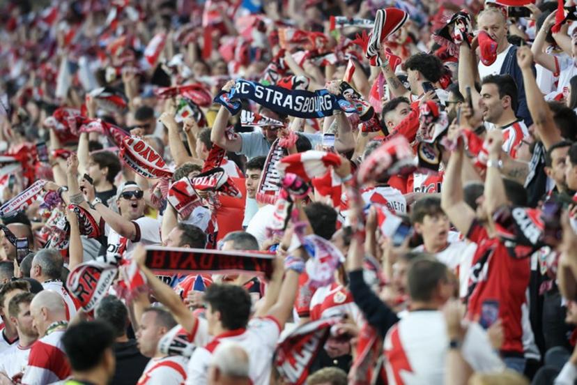 Supporters wave banners before the start of the UEFA Conference League semi final first leg football match between Rayo Vallecano de Madrid and RC Strasbourg Alsace at Vallecas Stadium in Madrid on April 30, 2026.  Pierre-Philippe MARCOU / AFP