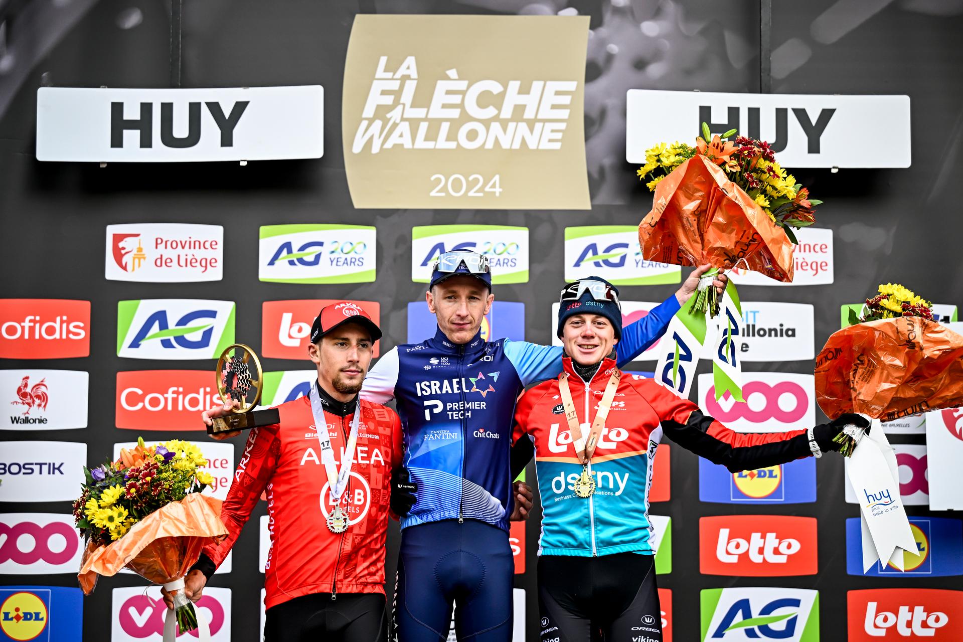 French Kevin Vauquelin of Arkea-BB Hotels, British Stevie Williams of Israel-Premier Tech and Belgian Maxim Van Gils of Lotto Dstny pictured on the podium after the men's race of the 'La Fleche Wallonne', one day cycling race (Waalse Pijl - Walloon Arrow), 199 km from Charleroi to Huy, Wednesday 17 April 2024. BELGA PHOTO JASPER JACOBS