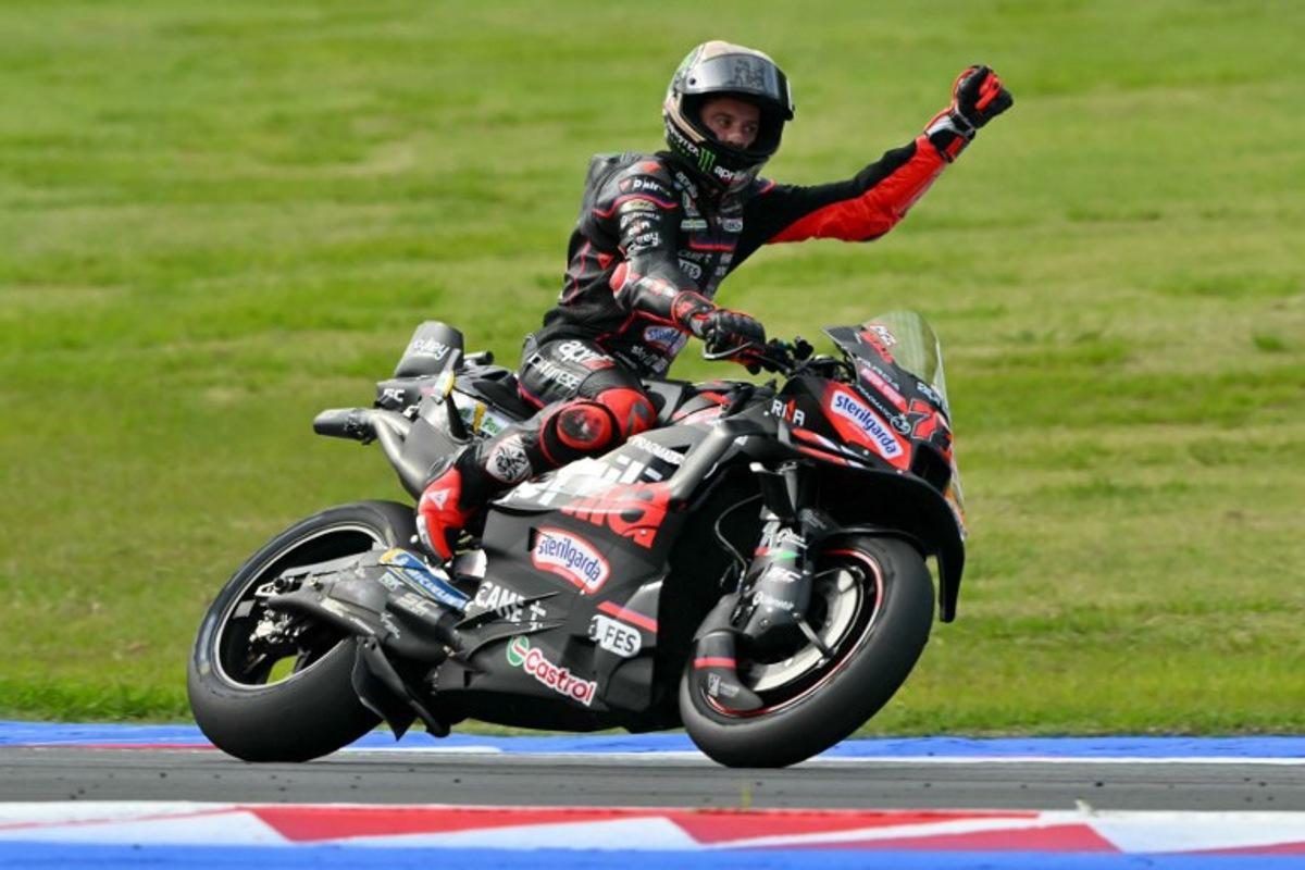 Aprilia Racing team's Italian MotoGP rider Marco Bezzecchi celebrates winning the San Marino Moto GP Sprint Race at the Misano World Circuit Marco Simoncelli, in Misano Adriatico, northern Italy, on September 13, 2025.  Andreas SOLARO / AFP