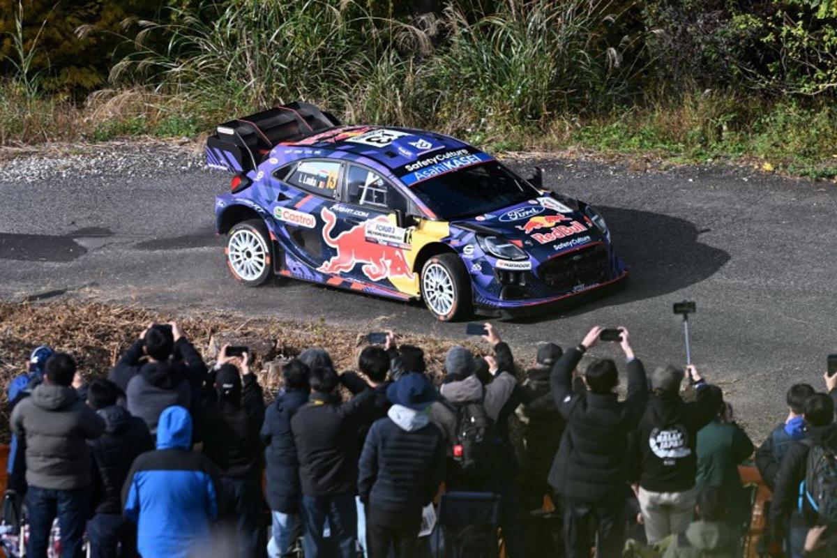 Gregoire Munster of Luxembourg and co-driver Louis Louka of Belgium drive their Ford Puma Rally1 during the SS9 Ena section of the Rally Japan, the 13th round of  FIA World Rally Championships, in Ena city, Gifu prefecture on November 8, 2025.  Toshifumi KITAMURA / AFP