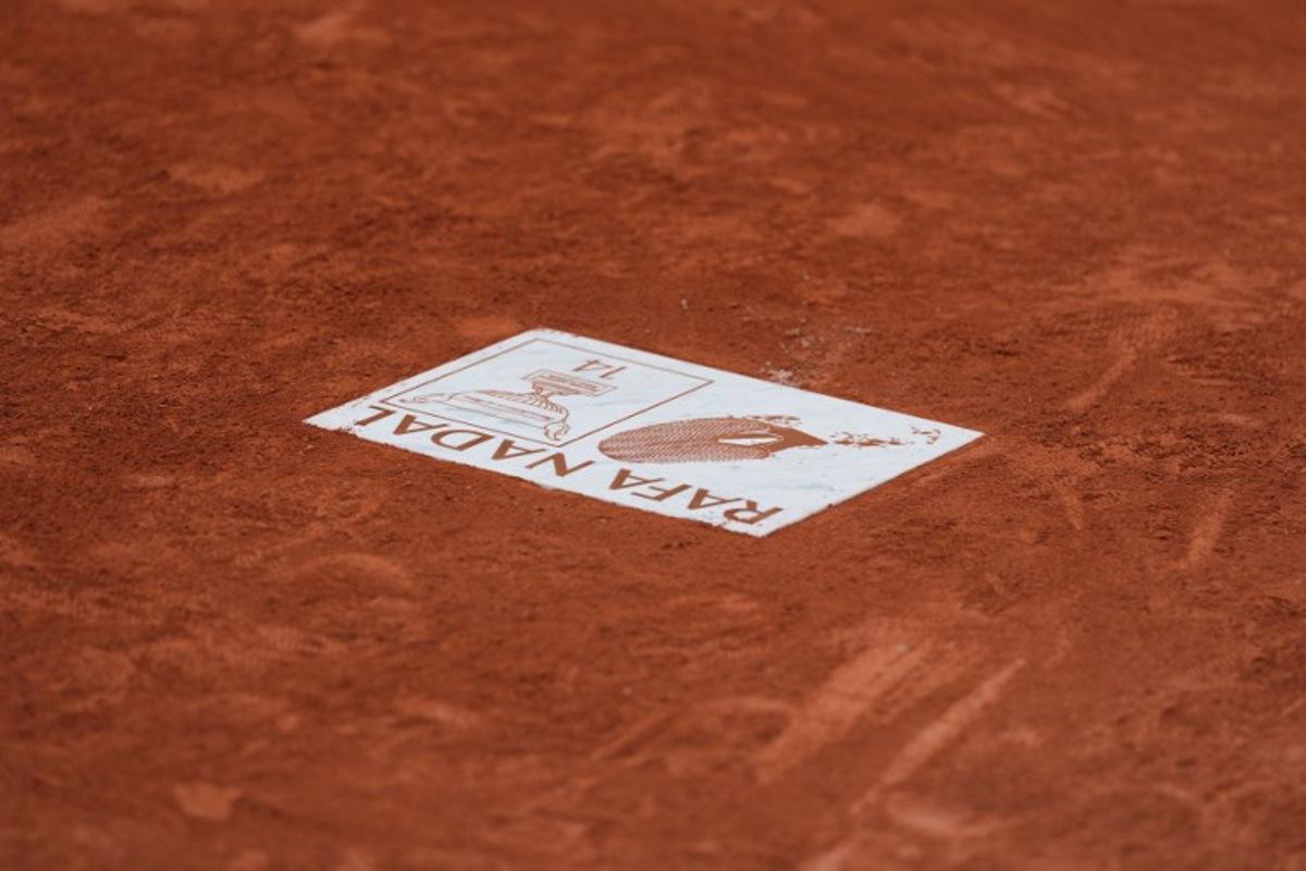 This photograph shows the plate honouring former Spanish tennis player Rafael Nadal and displayed on the Court Philippe-Chatrier, during the French Open tennis tournament at the Roland-Garros Complex in Paris on May 26, 2025.  Dimitar DILKOFF / AFP