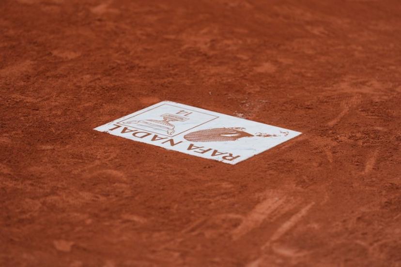 This photograph shows the plate honouring former Spanish tennis player Rafael Nadal and displayed on the Court Philippe-Chatrier, during the French Open tennis tournament at the Roland-Garros Complex in Paris on May 26, 2025.  Dimitar DILKOFF / AFP