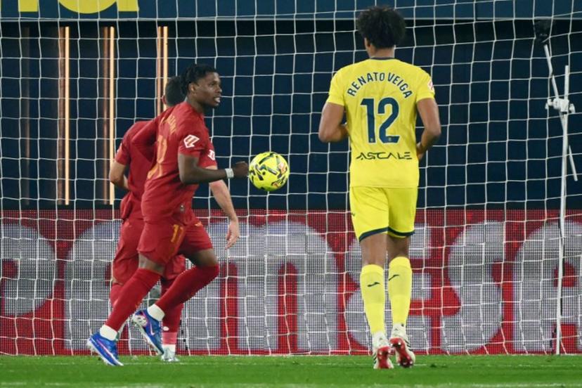 Valencia's Belgian forward # 17 Largie Ramazani celebrates after scoring the opening goal from the penalty spot during the Spanish league football match between Villarreal CF and Valencia CF at La Ceramica Stadium in Vila-real on February 22, 2026.  JOSE JORDAN / AFP