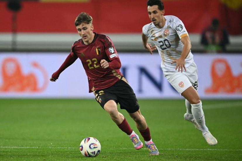 Belgium's midfielder #22 Alexis Saelemaekers (L) fights for the ball with North Macedonia 's forward #20 Bojan Miovski during the FIFA World Cup 2026 Group J European qualification football match between Belgium and North Macedonia at the Planet Group Arena in Ghent, on October 10, 2025.  NICOLAS TUCAT / AFP