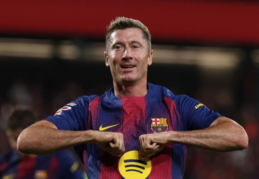 Barcelona's Polish forward #09 Robert Lewandowski celebrates scoring his team's sixth goal during the Spanish league football match between FC Barcelona and Valencia CF at Johan Cruyff Stadium in Barcelona, on September 14, 2025.  Lluis GENE / AFP