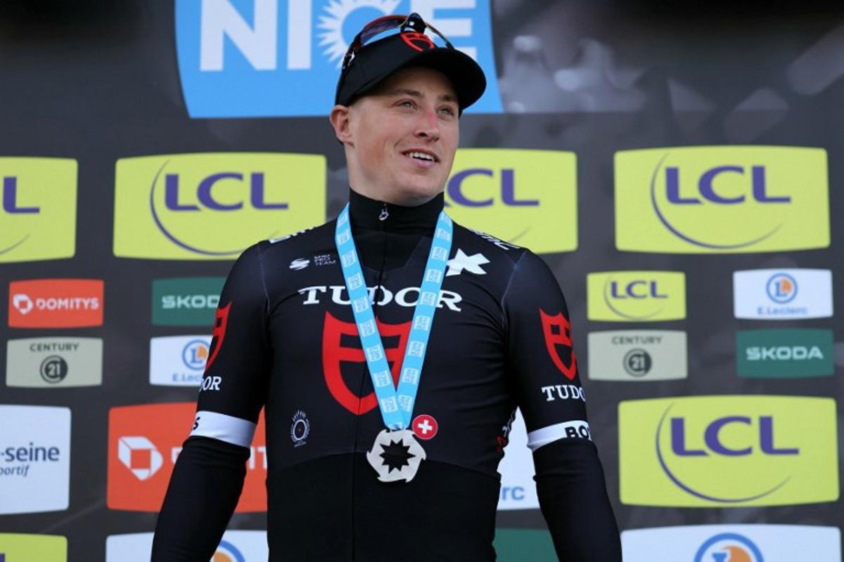 Stage winner Tudor Pro Cycling Team's Dutch cyclist Arvid De Kleijn celebrates on the podium after winning the 2nd stage of the Paris-Nice cycling race, 179 km between Thoiry and Montargis, on March 4, 2024.  Thomas SAMSON / AFP