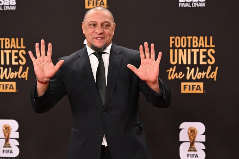 Former Brazilian soccer player Roberto Carlos poses on the red carpet upon arrival to attend the draw for the 2026 FIFA Football World Cup taking place in the US, Canada and Mexico, at the Kennedy Center, in Washington, DC, on December 5, 2025.  Roberto SCHMIDT / AFP