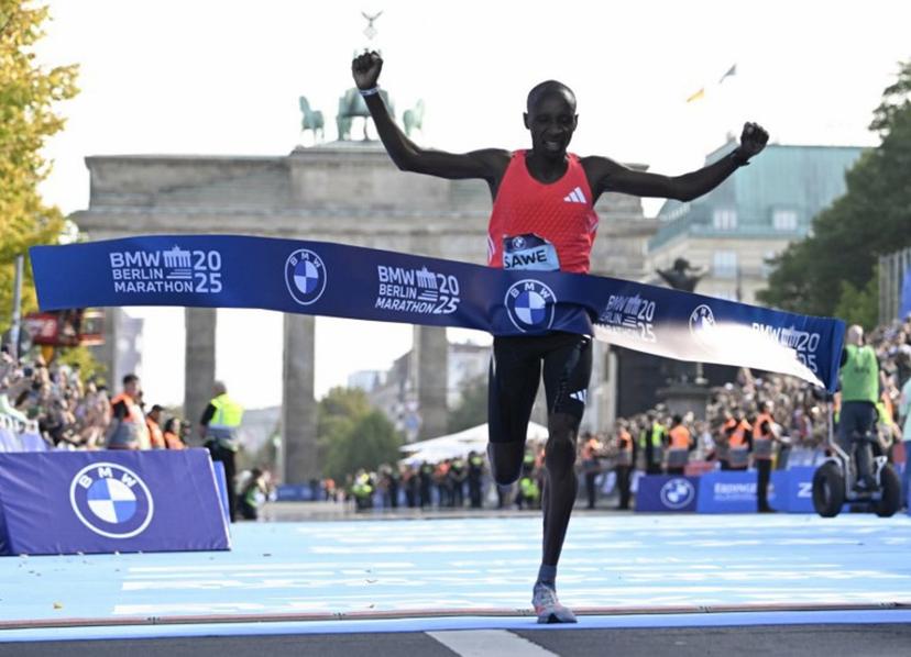 Kenya's Sabastian Sawe crosses the finish line to win the 51st edition of the Berlin Marathon in Berlin, Germany on September 21, 2025.  Tobias SCHWARZ / AFP