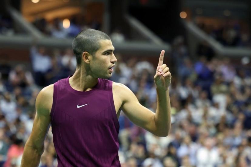 Spain's Carlos Alcaraz gestures after a point won against Italy's Mattia Bellucci during their men's singles second round tennis match on day four of the US Open tennis tournament at the USTA Billie Jean King National Tennis Center in New York City, on August 27, 2025.  CHARLY TRIBALLEAU / AFP