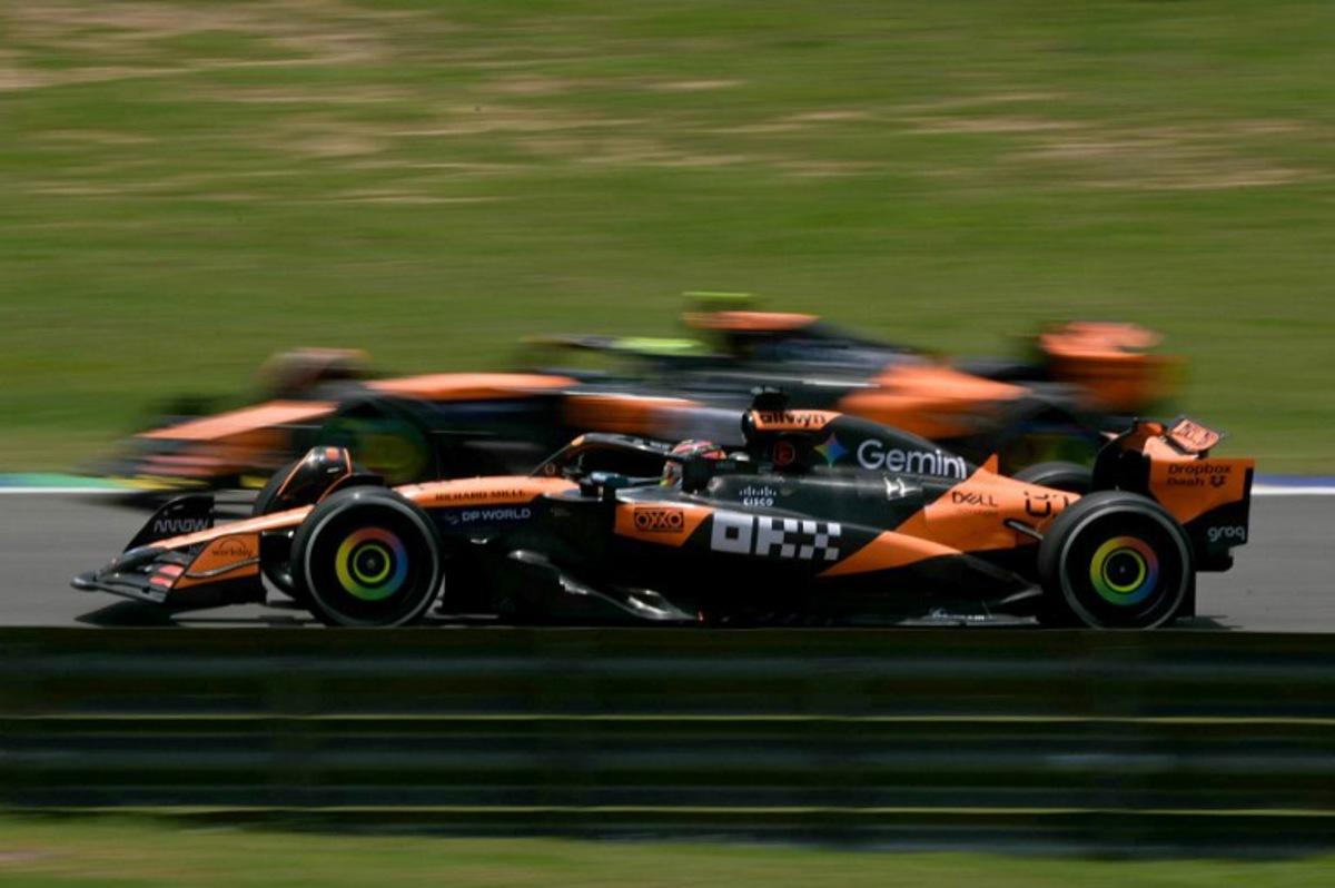 McLaren's British driver Lando Norris overtakes his teammate Australian driver Oscar Piastri during the practice session of the Sao Paulo Formula One Grand Prix at the Jose Carlos Pace racetrack, aka Interlagos, in Sao Paulo, Brazil on November 7, 2025.  Nelson ALMEIDA / AFP