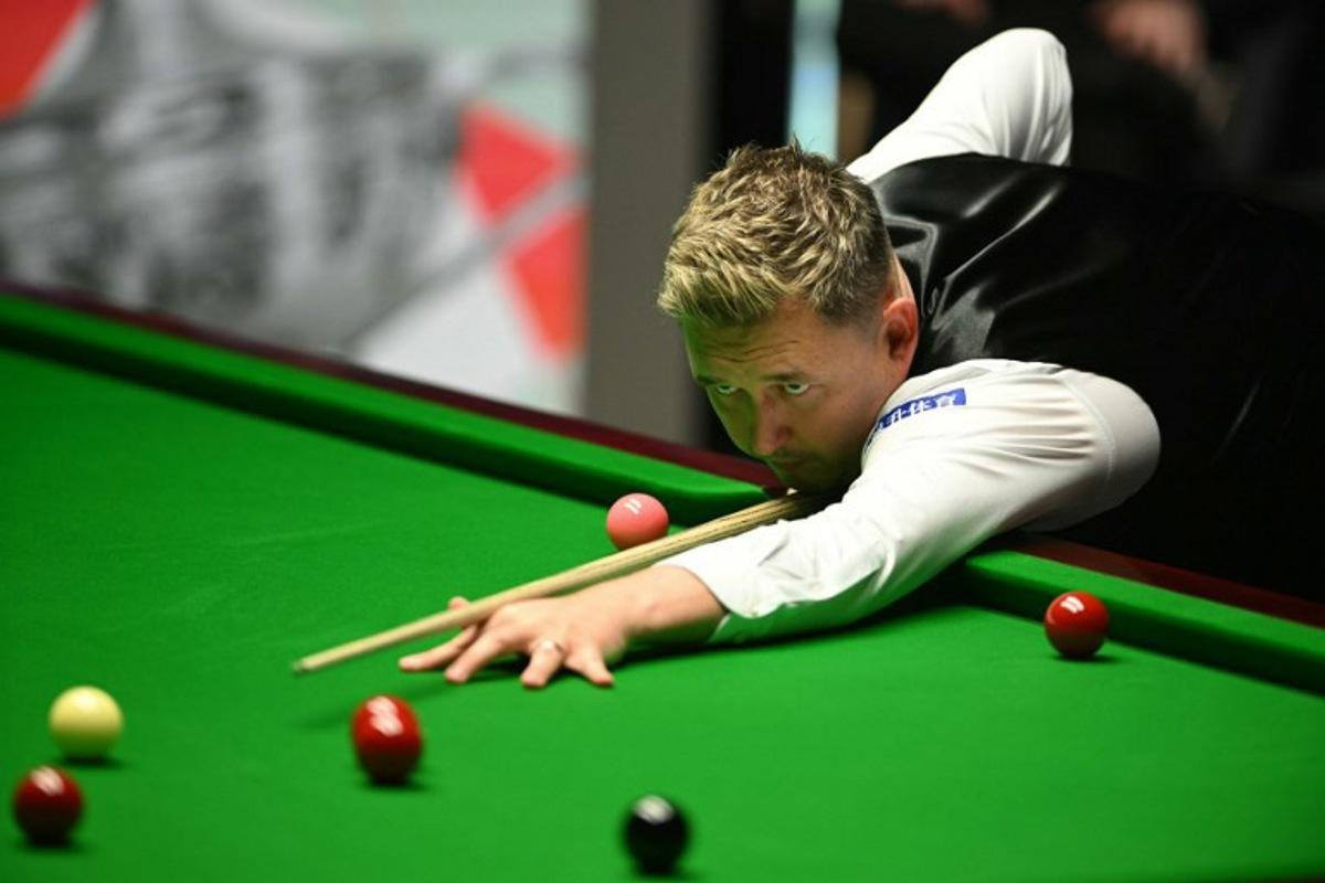 England's Kyren Wilson plays a shot on day two of his World Championship Snooker final  against Wales' Jak Jones during the evening session at The Crucible in Sheffield, northern England on May 6, 2024.   Oli SCARFF / AFP