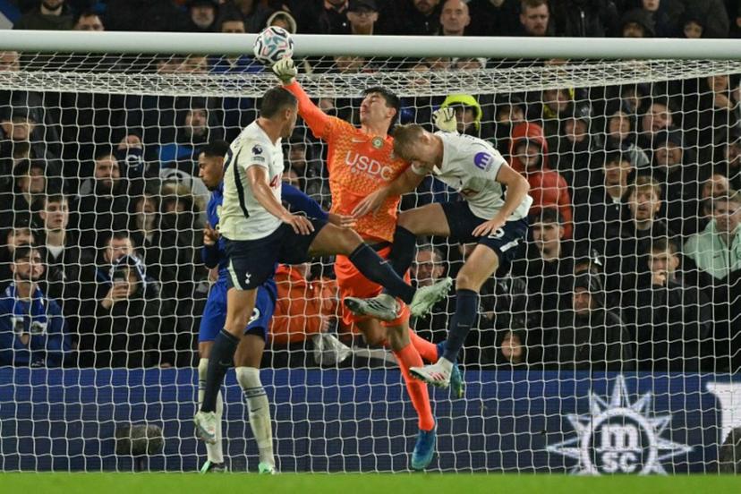 Chelsea's Belgian goalkeeper #39 Mike Penders punches the ball into his own net for an own-goal, Tottenham's opening goal during the English Premier League football match between Chelsea and Tottenham Hotspur at Stamford Bridge in London on October 24, 2026.  Glyn KIRK / AFP
