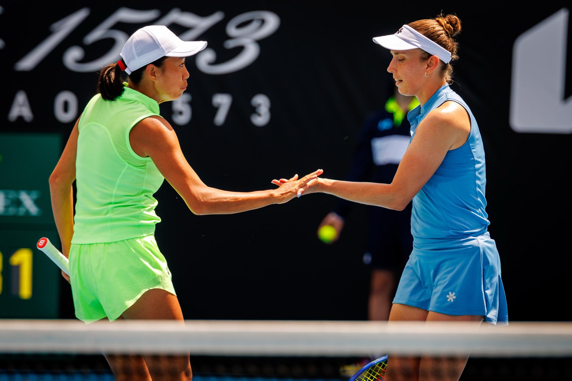 Belgian Elise Mertens (R) and her Chinese partner Shuai Peng celebrate during a doubles tennis match against Taiwanese-Japanese pair Wu-Hozumi, in the quarterfinals of the women doubles at the Australian Open, Melbourne Park, Melbourne on Wednesday 28 January 2026. Mertens - Zhang won the game. BELGA PHOTO PATRICK HAMILTON  --- BENELUX ONLY   ---