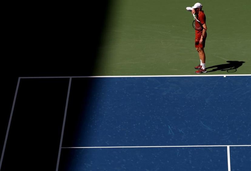 Italy's Jannik Sinner pauses as he plays Canada's Denis Shapovalov during their men's singles third round match on day seven of the US Open tennis tournament at the USTA Billie Jean King National Tennis Center in New York City on August 30, 2025.  TIMOTHY A. CLARY / AFP
