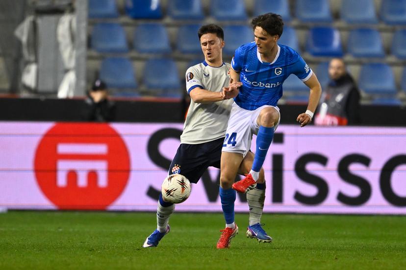 Dinamo's Mateo Lisica and Genk's Nikolas Sattlberger fight for the ball during a soccer game between Belgian team KRC Genk and Croatian GNK Dinamo Zagreb, Thursday 26 February 2026 in Genk, in the play-off for the knockout phase of the UEFA Europa League tournament. Genk won the first leg 1-3. BELGA PHOTO JOHAN EYCKENS