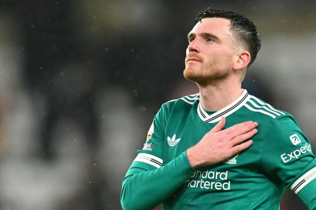 Liverpool's Scottish defender #26 Andrew Robertson applauds the fans following the English Premier League football match between Sunderland and Liverpool at The Stadium of Light in Sunderland in north east England on February 11, 2026.  ANDY BUCHANAN / AFP