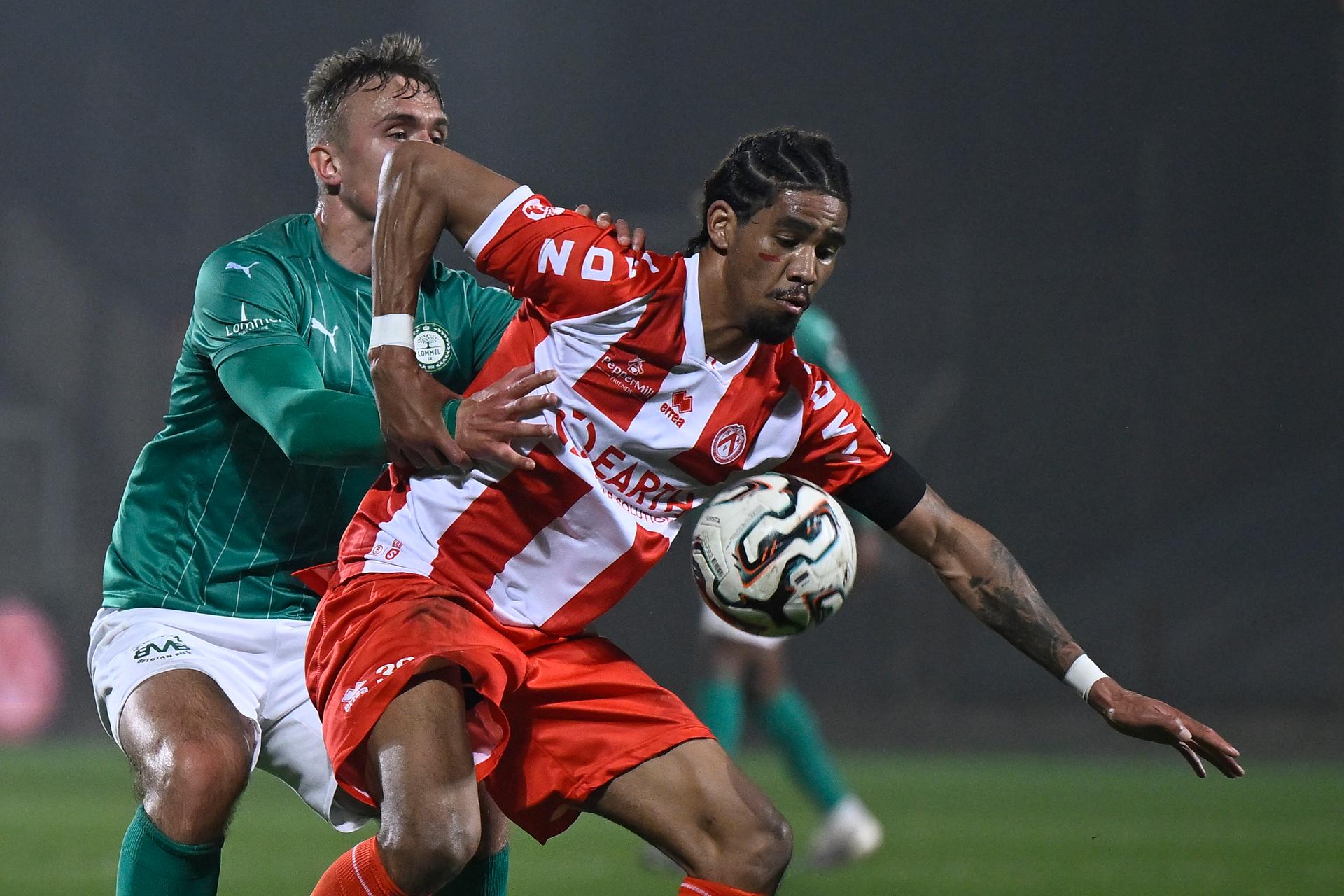 Lommel's Jesper Tolinsson and Kortrijk's Bryan Adinany fight for the ball during a soccer game between Lommel SK and KV Kortrijk, Saturday 07 March 2026 in Lommel, on day 28 (out of 34) of the 2025-2026 'Challenger Pro League' 1B second division of the Belgian championship. BELGA PHOTO JOHAN EYCKENS