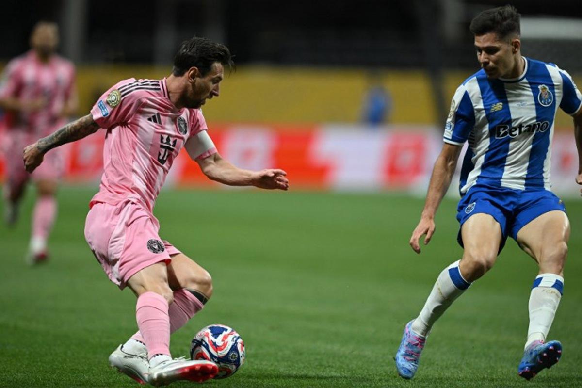 Inter Miami's Argentine forward #10 Lionel Messi (L) fights for the ball with FC Porto's Portuguese defender #74 Francisco Moura during the FIFA Club World Cup 2025 Group A football match between US Inter Miami and Portugal's FC Porto at the Mercedes-Benz stadium in Atlanta on June 19, 2025.  Federico PARRA / AFP