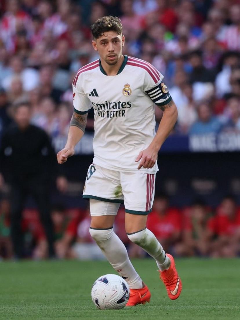 Real Madrid's Uruguayan midfielder #08 Federico Valverde runs with the ball during the Spanish league football match between Club Atletico de Madrid and Real Madrid CF at the Metropolitano stadium in Madrid on September 20, 2026.  Thomas COEX / AFP