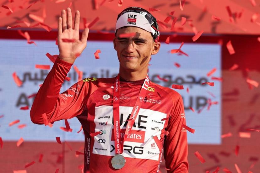 UAE Team Emirates's Mexican rider Isaac Del Toro Romero celebrates on the podium after winning the red jersey in the sixth stage of the UAE Tour cycling event from al-Ain Museum to Jebel Hafeet in Abu Dhabi on February 21, 2026.  Fadel SENNA / AFP