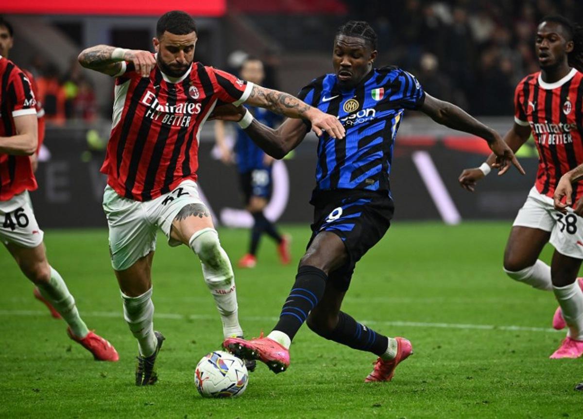 Inter Milan's French forward #09  Marcus Thuram (R) fights for the ball with AC Milan's British defender #32 Kyle Andrew Zac Walker during the Italian Cup semi-final first leg football match between AC Milan and Inter Milan at San Siro stadium in Milan, on April 2, 2025.  Isabella BONOTTO / AFP