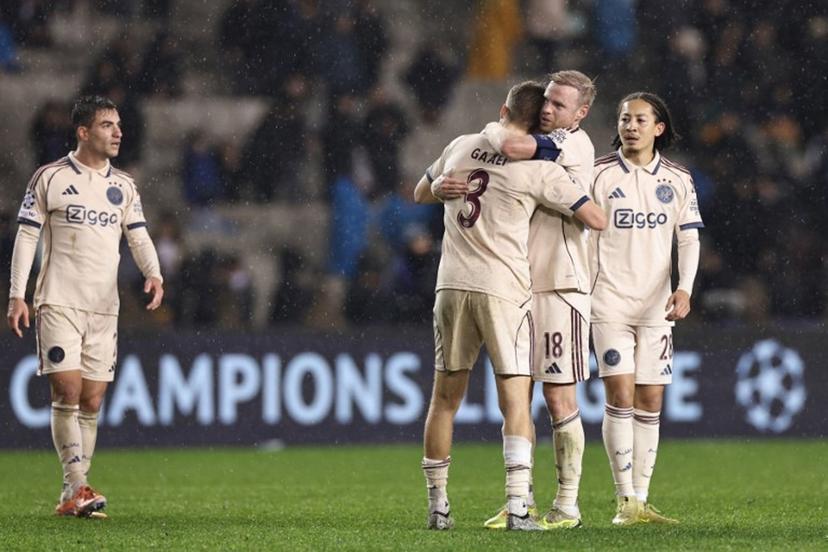 Ajax's players celebrate after the UEFA Champions League league phase football match between Qarabag and Ajax at the Tofiq Bahramov Republican Stadium in Baku on December 10, 2025.  Giorgi ARJEVANIDZE / AFP