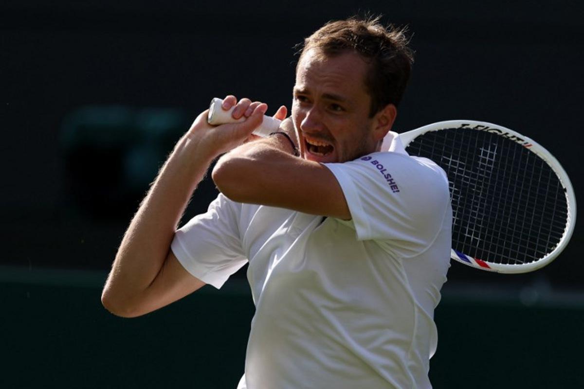 Russia's Daniil Medvedev returns to Croatia's Marin Cilic during their men's singles first round tennis match on the first day of the 2026 Wimbledon Championships at The All England Lawn Tennis and Croquet Club in Wimbledon, southwest London, on June 29, 2026.  Adrian Dennis / AFP