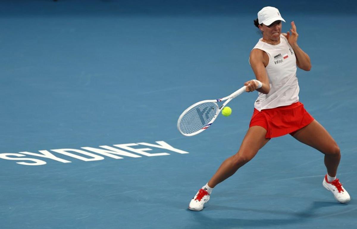 Poland's Iga Swiatek hits a return to Australia's Maya Joint during their women's singles quarter-final match at the United Cup at Ken Rosewall Arena in Sydney on January 9, 2026.  Izhar Khan / AFP