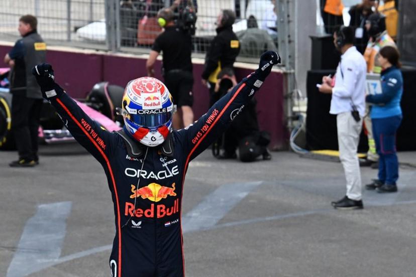 Red Bull Racing's Dutch driver Max Verstappen celebrates in the parc ferme after winning the Formula One Azerbaijan Grand Prix at the Baku City Circuit in Baku on September 21, 2025.   Ozan KOSE / AFP