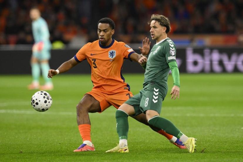 Netherlands' defender #03 Jurrien Timber (L) and Lithuania's midfielder #08 Tomas Kalinauskas (R) fight for the ball during the FIFA World Cup 2026 Group G European qualification football match between the Netherlands and Lithuania at the Johan Cruijff Arena, in Amsterdam, on November 17, 2025. JOHN THYS / AFP