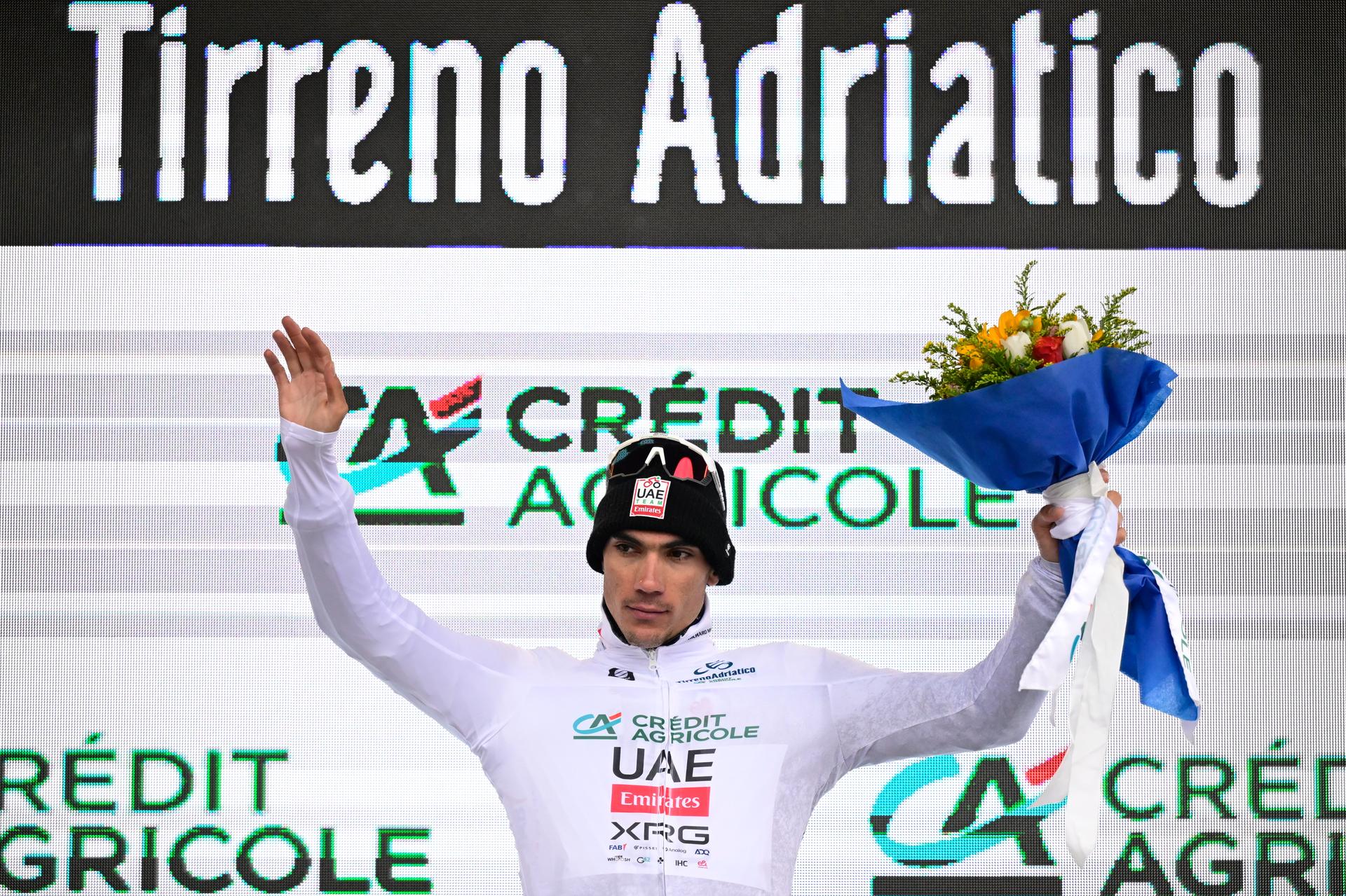 Spanish Juan Ayuso of UAE Team Emirates celebrates on the podium in the white jersey after the third stage of the Tirreno-Adriatico cycling race, a 239km race from Follonica to Colfiorito (Foligno), Italy, Wednesday 12 March 2025. BELGA PHOTO DIRK WAEM
