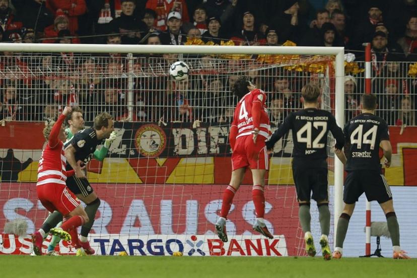 Union Berlin's Danish goalkeeper #01 Frederik Ronnow (2L) reacts as Union Berlin's Portuguese defender #04 Diogo Leite (C) heads the ball to score an own goal during the German Cup (DFB-Pokal) round of 16 football match between 1 FC Union Berlin and FC Bayern Munich in Berlin on December 3, 2025.  Odd ANDERSEN / AFP