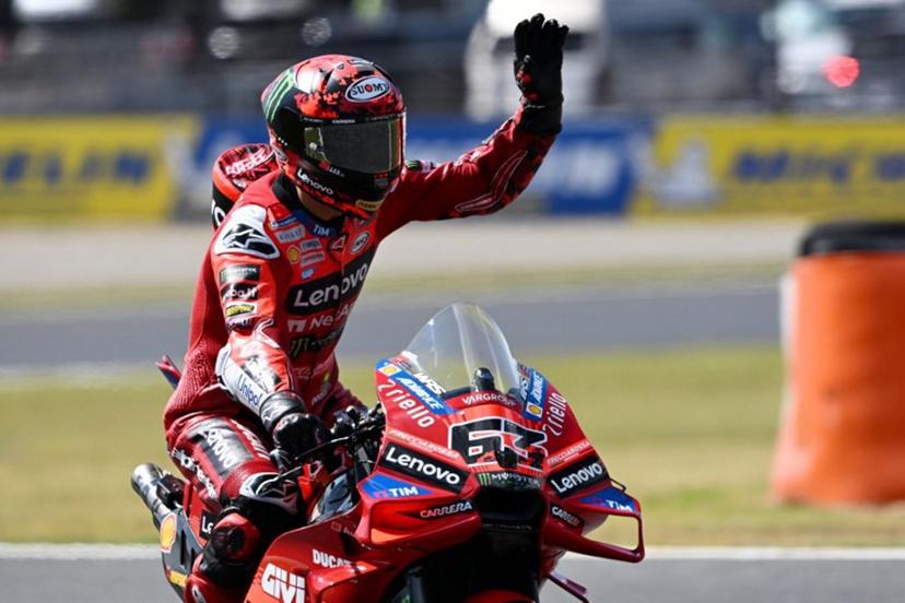 Ducati Lenovo Team rider Francesco Bagnaia of Italy waves to fans during the MotoGP class practice session of the Japanese MotoGP Grand Prix at Mobility Resort Motegi in Motegi, Tochigi prefecture on September 27, 2025.   Toshifumi KITAMURA / AFP