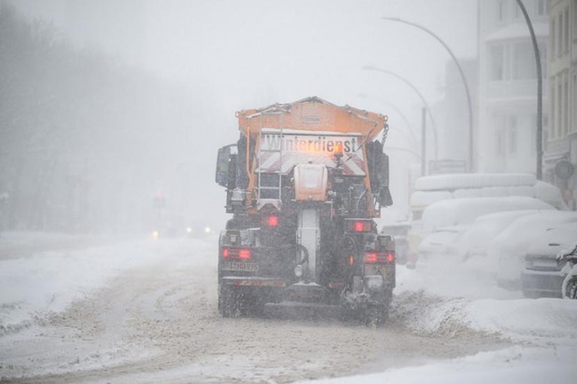 A snowplow operates on a road during heavy snowfall in Hamburg, Germany, on January 9, 2026. Storm Elli has arrived in northern Germany with heavy winds and snow.  DANIEL REINHARDT / AFP