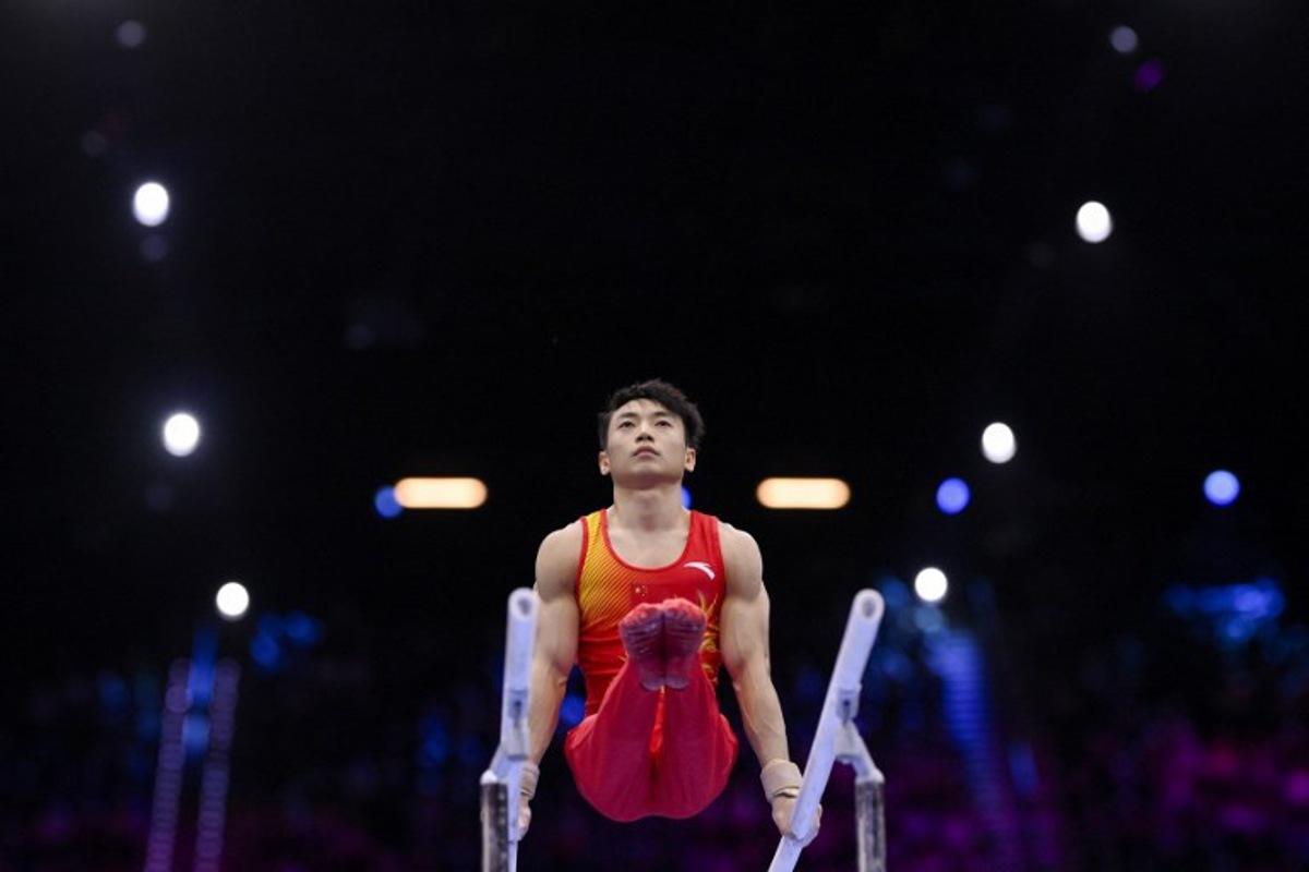 China's Jingyuan Zou competes in the Men's Parallel Bars Final during the 54th FIG Artistic Gymnastics World Championships, in Rotterdam, southern Netherlands, on October 25, 2026.  JOHN THYS / AFP