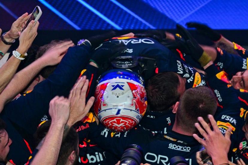 Red Bull Racing's Dutch driver Max Verstappen celebrates with his team after winning the Formula One Qatar Grand Prix at the Lusail International Circuit in Lusail on November 30, 2025.  Andrej ISAKOVIC / AFP