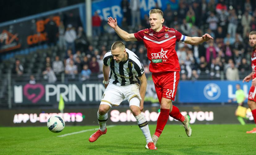 Charleroi's Nikola Stulic and Dender's Gilles Ruyssen fight for the ball during a soccer match between Sporting Charleroi and FCV Dender EH, Saturday 26 April 2025 in Charleroi, on day 6 (out of 10) of the Europe Play-offs of the 2024-2025 'Jupiler Pro League' first division of the Belgian championship. BELGA PHOTO VIRGINIE LEFOUR