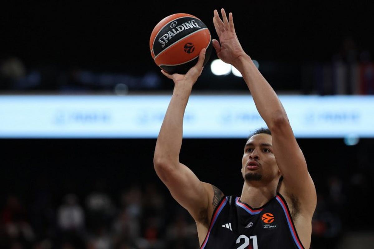 Paris Basketball's Belgian pivot #21 Ismael Bako performs a free throw during the Euroleague basketball match between Paris Basketball and Virtus Bologna at the Adidas Arena, in Paris, on October 9, 2025.  Anne-Christine POUJOULAT / AFP