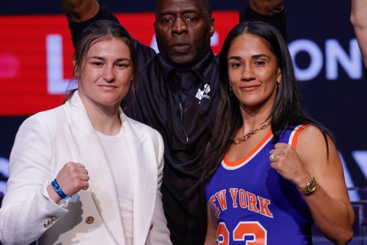 Irish boxer Katie Taylor (L) and Puerto Rican boxer Amanda Serrano pose at a press conference at the Apollo Theatre in New York, on May 13, 2024.  Kena Betancur / AFP