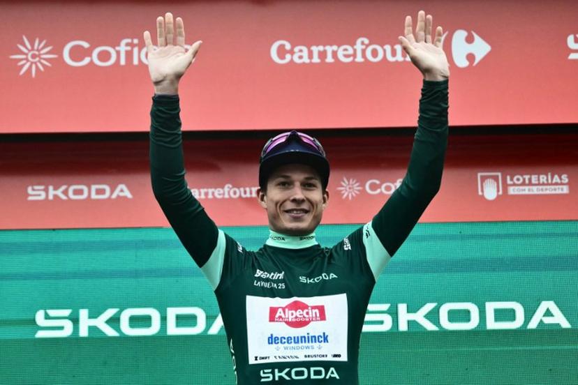 Team Alpecin's Belgian rider Jasper Philipsen, wearing the best sprinter's green jersey, poses on the podium after winning the second stage of the Vuelta a Espana, a 159,6 km race between Alba and Limone Piemonte, in Italy's Piemonte region, on August 24, 2025.   Marco BERTORELLO / AFP