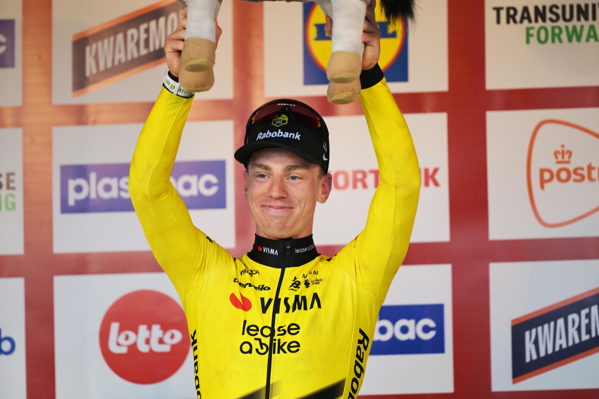 Great Britain's Matthew Brennan of Team Visma-Lease a Bike celebrates on the podium after winning the 78th edition of the men elite race of the Kuurne-Brussels-Kuurne one day cycling race, 195 km from Kuurne to Kuurne via Brussels, Sunday 01 March 2026.  BELGA PHOTO DAVID PINTENS