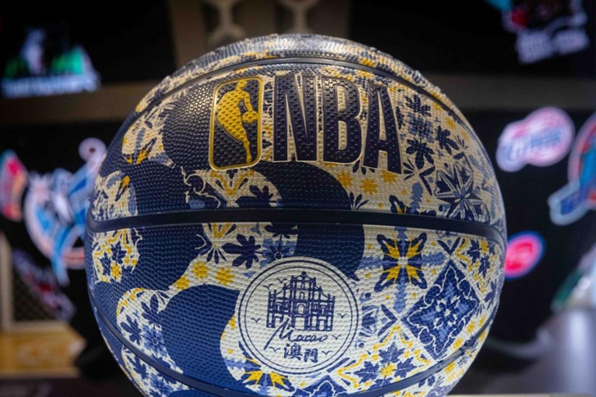 A customised Macau basketball stands at the Wilson stall at the NBA House before the NBA pre-season basketball game between the Phoenix Suns and Brooklyn Nets at the Venetian Arena in Macau on October 12, 2025.  Eduardo Leal / AFP