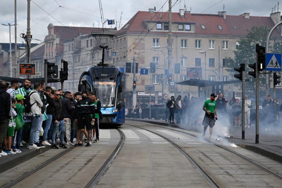 Real Betis fans block tram tracks in central Wroclaw on May 28, 2025, ahead the UEFA Conference League Final between Real Betis and Chelsea FC in Wroclaw on May 28, 2025.   Sergei GAPON / AFP