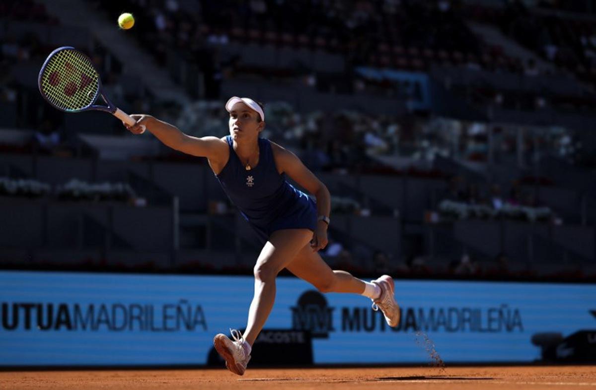 Belgium's Elise Mertens returns the ball to Belarus' Aryna Sabalenka during their 2025 WTA Tour Madrid Open tennis tournament third round singles match at the Caja Magica in Madrid, on April 27, 2025.   Thomas COEX / AFP