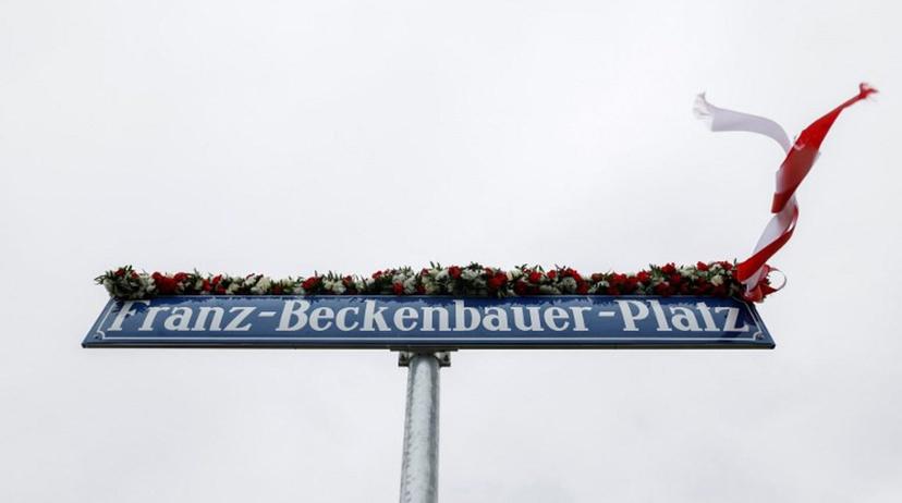 The new street sign for the 'Franz-Beckenbauer-Platz', a square named after German football legend Franz Beckenbauer, is pictured near the Allianz Arena Stadium in Munich, southern Germany, May 5, 2025.   Since May 1, 2025, the stadium's official address has been changed to Franz Beckenbauer Platz 5 to honour the German football icon. The No. 5 shirt number was famously worn by Beckenbauer. He died aged 78 on January 7, 2024. Michaela STACHE / AFP
