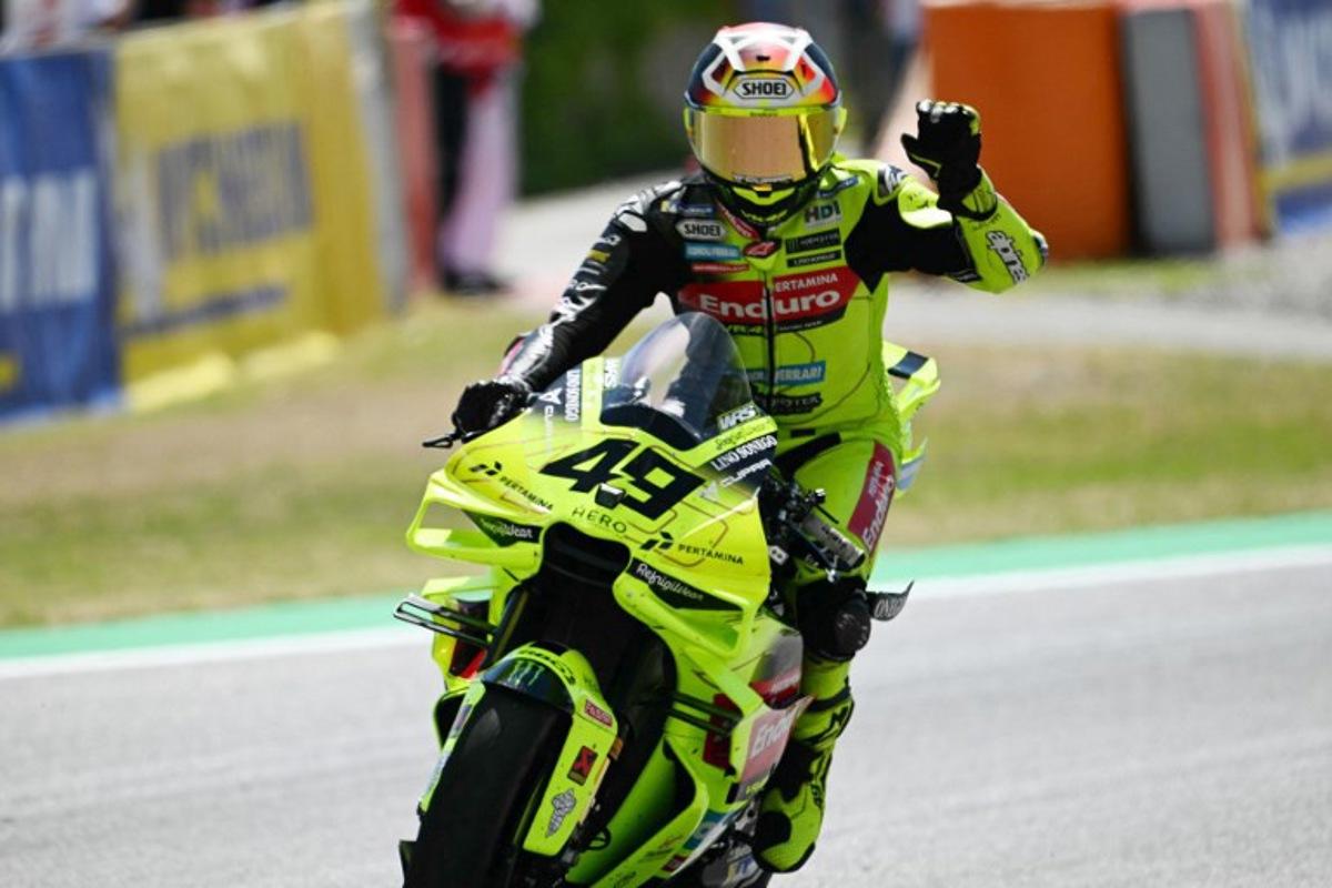 Team Pertamina Enduro VR46 Racing Team's Fabio Di Giannantonio celebrates his thirs place after the Sprint Race at the Catalunya Moto GP Grand Prix at the Catalunya racetrack in Montmelo, near Barcelona, on May 16, 2026.  Jose Jordan / AFP